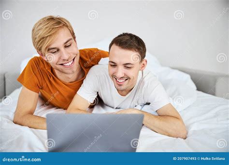 Happy Gay Couple Watching Movie Together On Laptop Stock Image Image Of Notebook Device