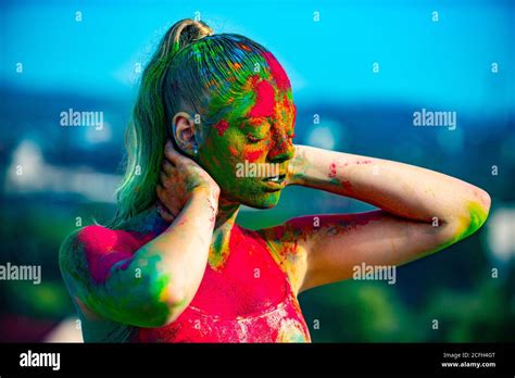 Multi Colored Face Fully Covered With Bright Holi Paint Colorful Holi