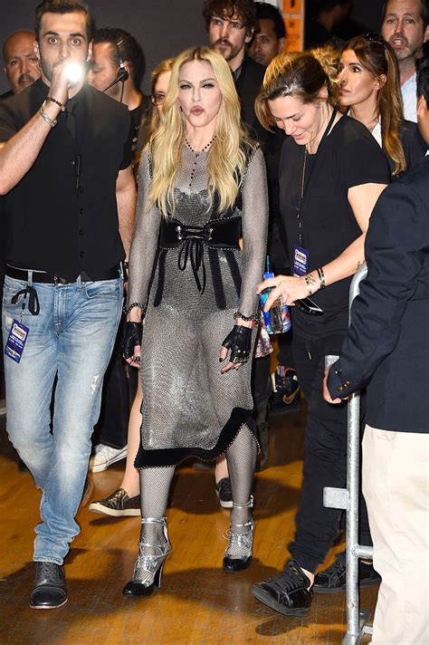 Madonna sparks rumors of butt enhancement as she displays curvier ...