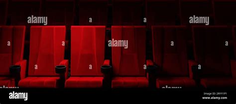 Rows Of Red Velvet Seats Watching Movies In The Cinema With Spotlight