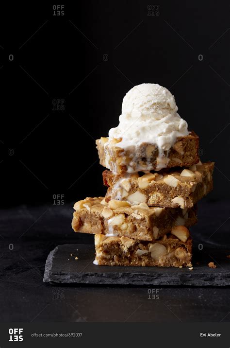 Dessert bars with nuts served with ice cream stock photo - OFFSET