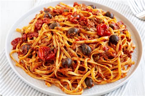 Homemade Tuna Linguine Pasta With Tomatoes Olives And Capers On A