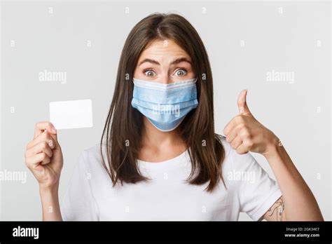 Covid 19 Health And Social Distancing Concept Close Up Of Pretty Brunette Girl In Medical Mask