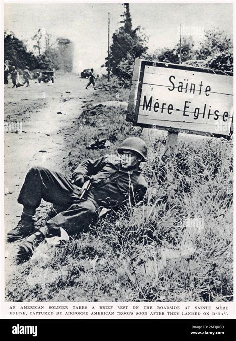 An American Paratrooper Taking A Brief Rest On The Roadside At St Mere