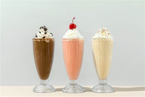 Mixed Flavor Milkshakes At A Cafe Premium Image By