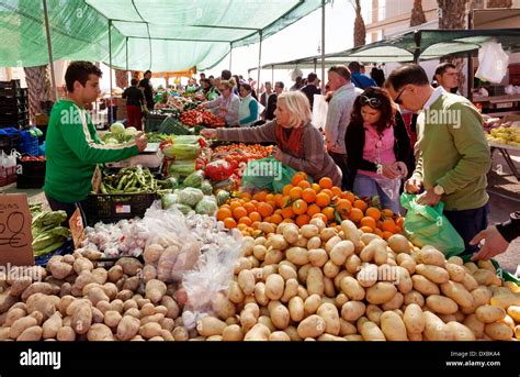 Spain Market People Buying Veg Vegetables From A Stall At The Village