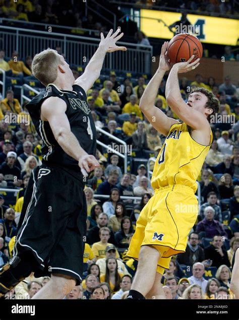 Michigan Forward Zack Novak 0 Shoots Over Purdue Forward Robbie