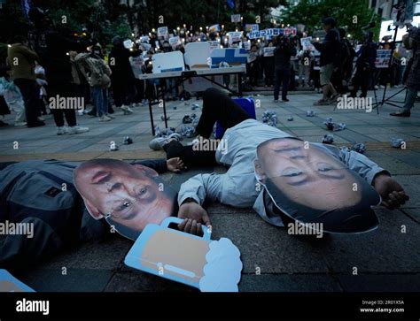 Protesters Wearing Masks Of Japanese Prime Minister Fumio Kishida And