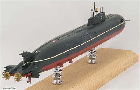 a model of a submarine sitting on top of a wooden stand