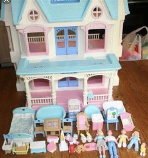 a doll house with lots of furniture and accessories