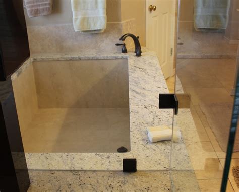 Undermount Marble Tub With Bianco Romano Granite And Frameless Shower