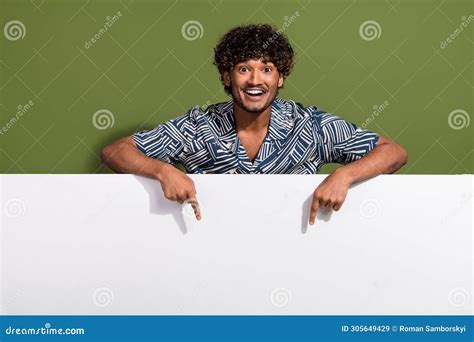 Photo Of Excited Funky Man Dressed Print Shirt Pointing White Placard Empty Space Isolated Green