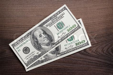 Two hundred dollars banknotes on the ... | Stock image | Colourbox