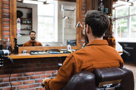 Back View Of Brunette Man Sitting Stock Photo Image Of Service Chair