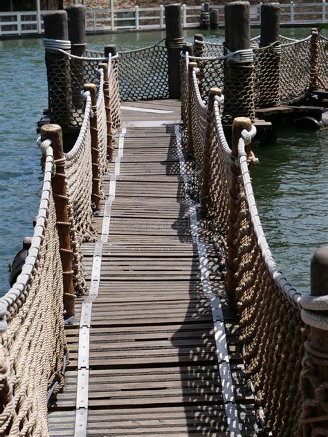 A Wooden And Rope Bridge Stock Photo Image Of Boardwalk 275841516