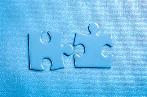 Blue Puzzle Pieces On A Blue Textured Background Stock Photo Download