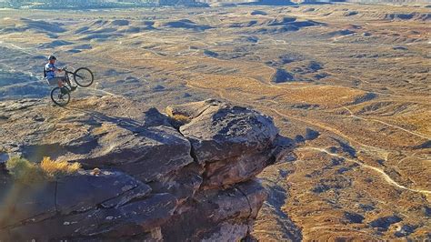 riding mountain bikes   edge   cliff extreme mountain