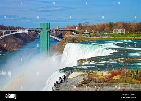 Rainbow In Niagara Falls And Rainbow Bridge Over Niagara River Gorge