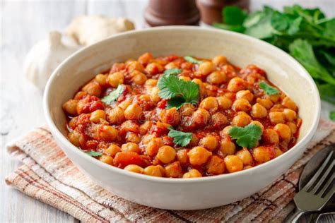 Spicy Chickpea Curry Chana Masala In Bowl On Wooden Table Stock Image