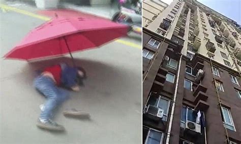 Chinese Boy Jumped Off His Home Holding An Umbrella