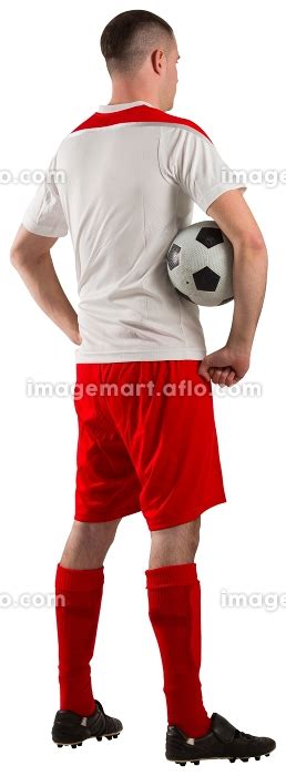 Football Player Holding The Ball On White Background