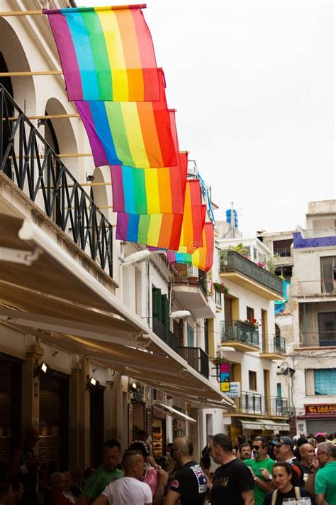 People With Rainbow Flag At Gay Pride Parade In Sitges Editorial