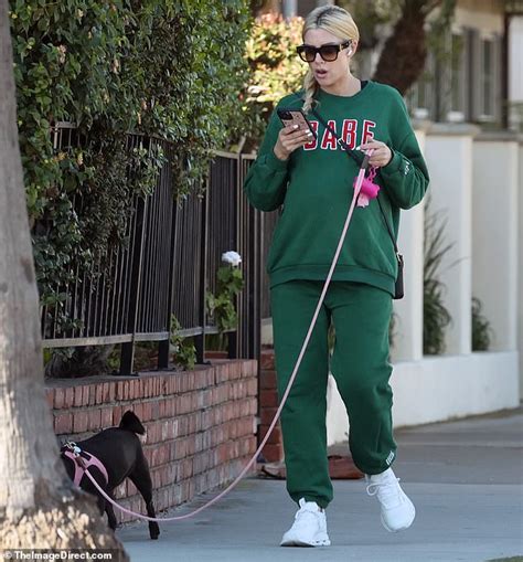 Heather Rae El Moussa Covers Up Her Growing Baby Bump While Walking Her