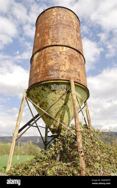 Rusted Water Tank In A Field Stock Photo Alamy