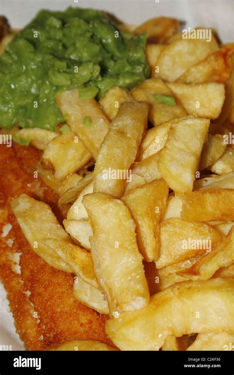 fish, chips and mushy peas from fish shop Stock Photo - Alamy