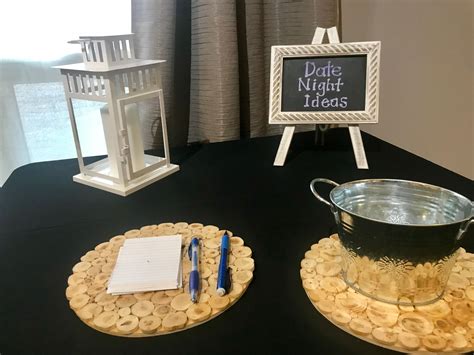 A Black Table Topped With Two Metal Buckets Filled With Cookies Next To A Sign That Says Data