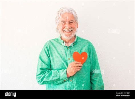 Portrait Of One Mature Man Smiling And Looking At The Camera With A Red