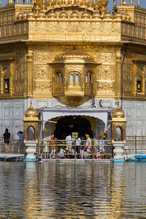 Sikhs And Indian People Visiting The Golden Temple In Amritsar Punjab