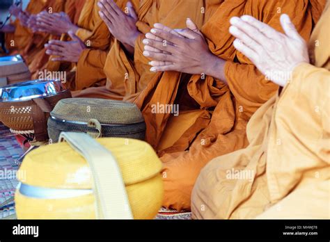 Buddhist monks praying Stock Photo - Alamy