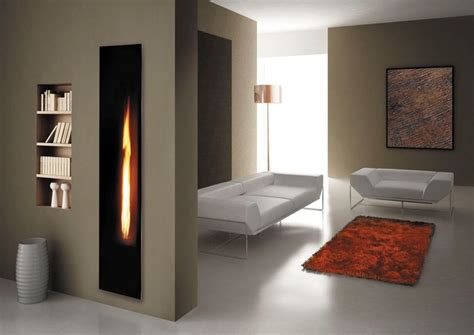 Vertical Black Wall Glass Fireplace On Grey Painted Wall Beside Tier