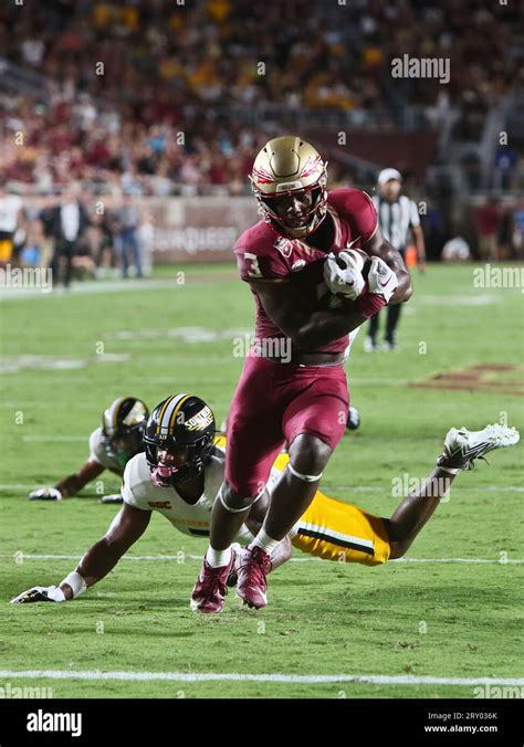 Florida State running back Trey Benson (3) runs for a touchdown past a ...