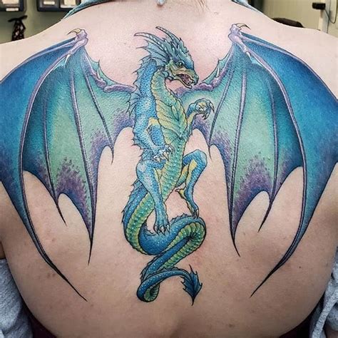 A Woman With A Dragon Tattoo On Her Back