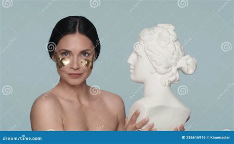 Portrait Of A Seminude Woman With Golden Patches Under Her Eyes On A