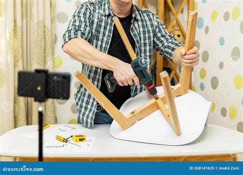 Handyman Shows Assembling Chair Shooting Video Instructions On
