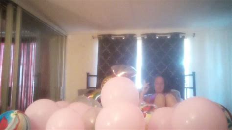 MILF With Extreme Long Hair Popping Balloons And Smoking Cigarettes While Filming Up Her Own Skirt