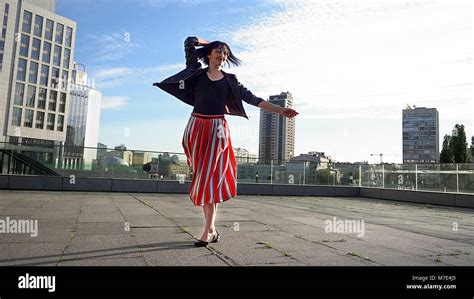 Beautiful Brunette Woman Is Dancing Outdoors Stock Photo Alamy