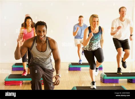 Group Of People At Step Aerobics Class Stock Photo Alamy