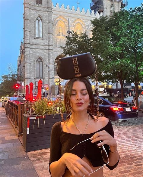 A Woman Wearing A Pirate Hat On Her Head While Standing In Front Of A