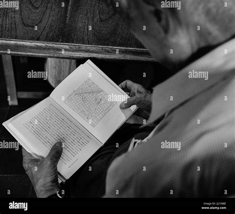 A An Old Senior Male Man Person Reading A Book Black And White Stock