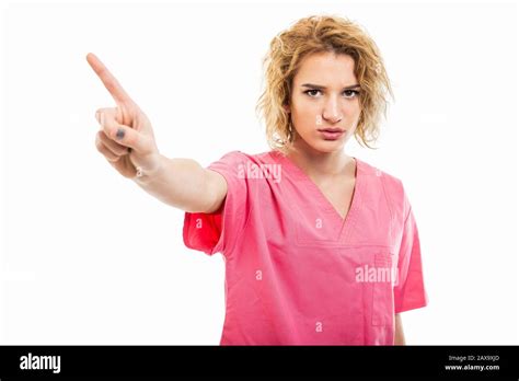 Portrait Of Nurse Wearing Pink Scrub Showing Denial Gesture Isolated On