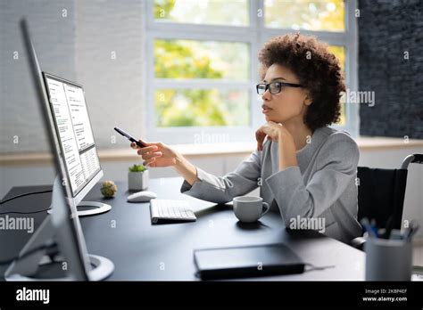 Software Programmer Or Coder Woman Using Office Computer Stock Photo