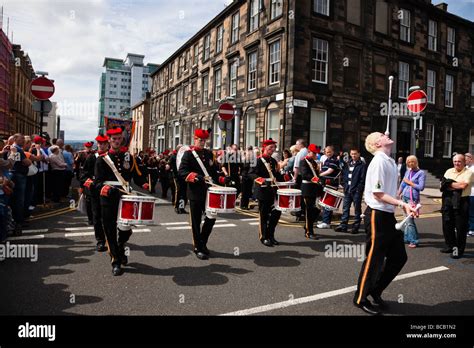 Members Of The Orange Lodge Marching At The Annual Orange Walk In