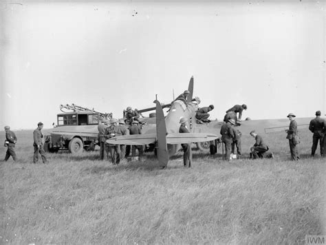 Asisbiz Hurricane I RAF 73Sqn Being Refuelled And Re Armed At Reims