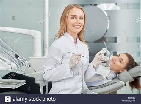 Download This Stock Image Charming Female Dentist Posing Beautiful Woman Smiling Looking At