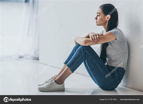 Side View Beautiful Upset Brunette Girl Sitting Looking Away Stock