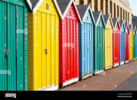 Beautifully Coloured Beach Huts On The Promenade At Boscombe Beach On